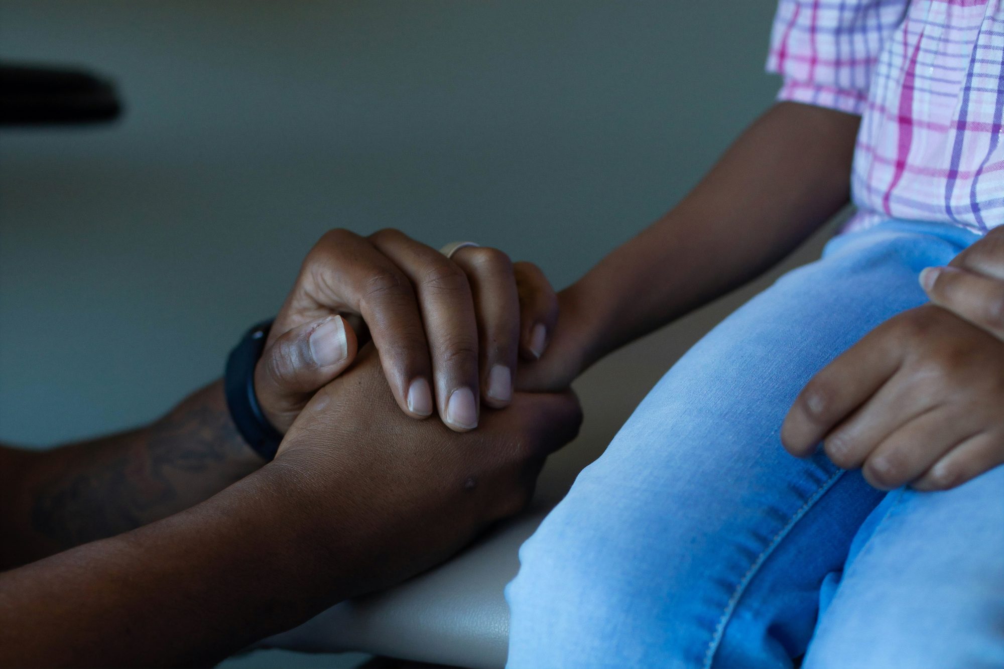 A clinician listening to a patient with care